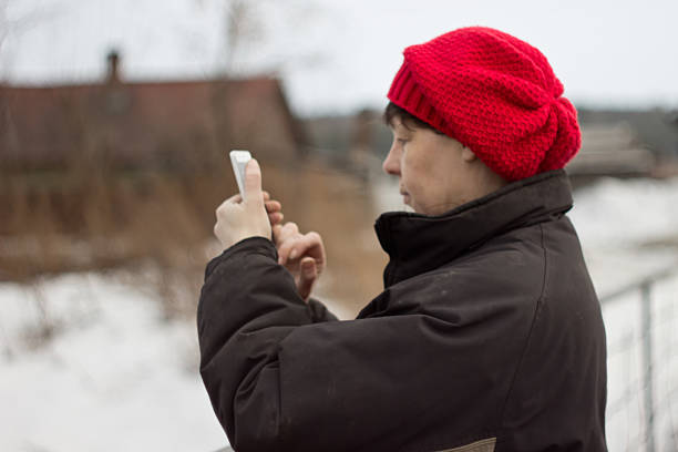 taking pictures and recording a video with the smartphone, detail of hands