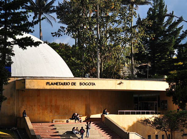 Mexico City, Mexico- March 28, 2006: Torre de Humanidades CU. View of one of the inner courtyards in the UNAM - Mexico National Autonomous University campus, in front of the humanities tower in a cloudy afternoon with some students walking by. A UNESCO world heritage site