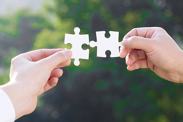 istock puzzle jigsaw and concept with trees background 523783681