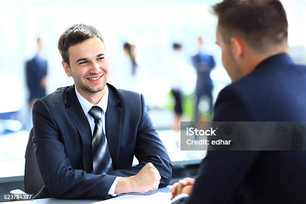 Happy Business People Talking On Meeting At Office Stock Photo - Download Image Now - Adult, Beautiful People, Business