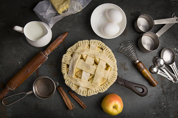 Not baked apple pie with Ingredients for baking stock photo