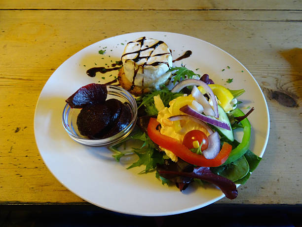 istock Goat's cheese salad, balsamic-vinegar dressing, lettuce, peppers, tomatoes, coleslaw, beetroot 523784879