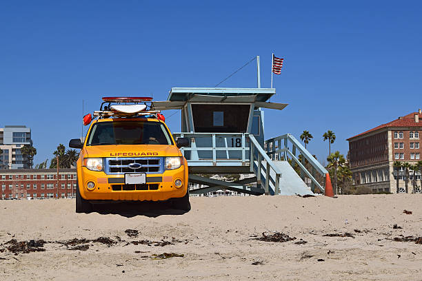 Summer beach goers enjoy beautiful sandy Zuma beach, Malibu, Ca