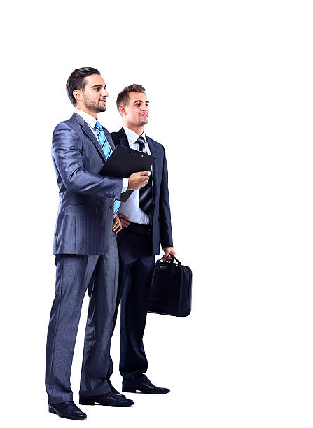 istock Two businessman looking at white background 523787577