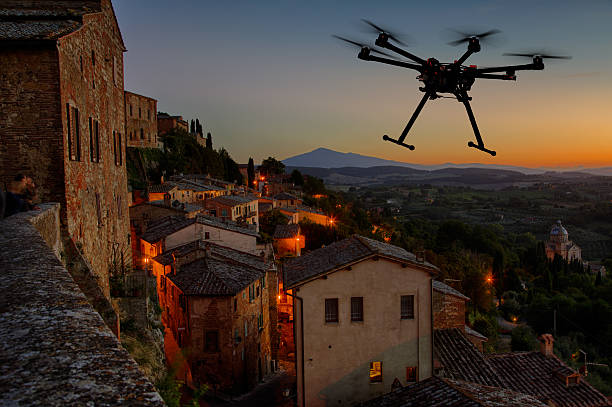 istock Flying drone in the sunset skies 523787735