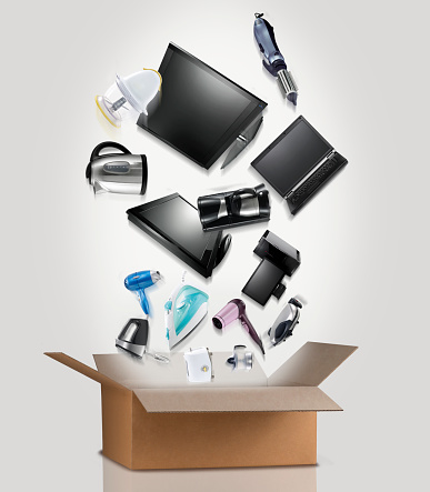household appliances with box.Electronic items coming out of a cardboard box.