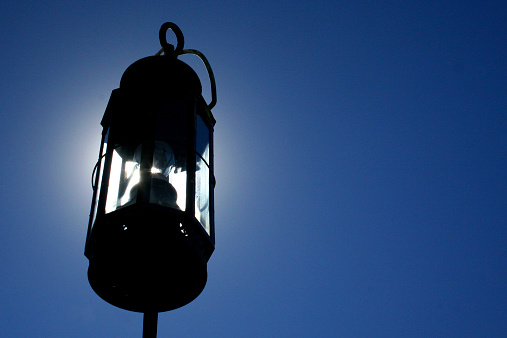 A hanging lamp and a mountain view in the background