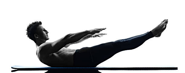 istock man pilates exercises fitness isolated 523818604