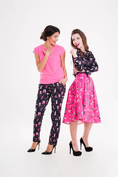istock Two happy pretty young women standing and smiling 523818662