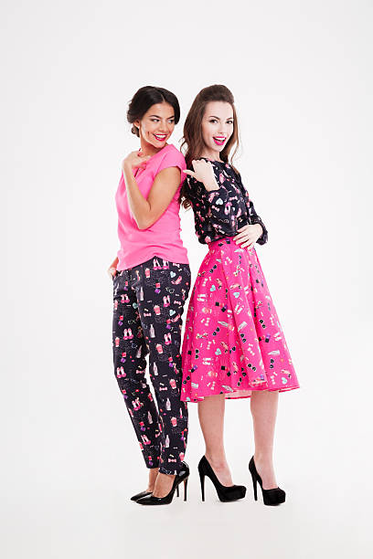 istock Two cheerful attractive young women standing together 523818760