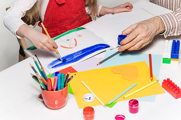 istock The daughter and father drawing together 523818794
