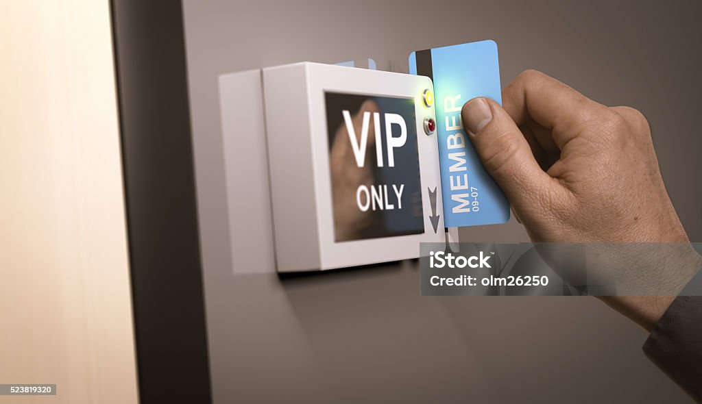 VIP Pass, Exclusive Access Hand with blue pass card unlocking access to a VIP room. Concept image for illustration of customers exclusive privileges. Exclusive Stock Photo