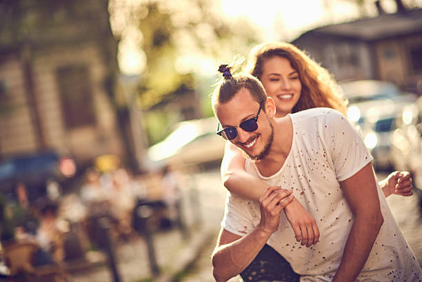 istock Young couple hugging in the city 523821454