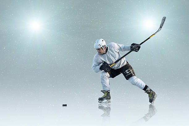 istock Ice hockey player on the ice and light effects 523822166