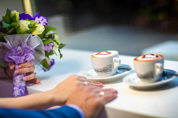 istock Man and woman's hands with espousal rings, coffee, wedding 523822816