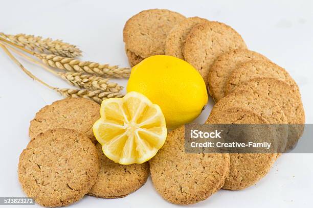 Integral Biscuits With Lemon On White Background Stock Photo - Download Image Now - Backgrounds, Baked, Baked Pastry Item