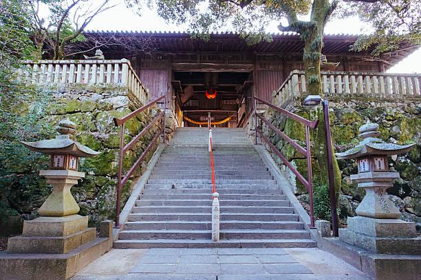 Steps leading into Kibitsu Shrine, a shinto shrine Steps up to the entrance of Kibitsu Shrine, a shinto shrine in Okayama, Japan. shrine stock pictures, royalty-free photos & images