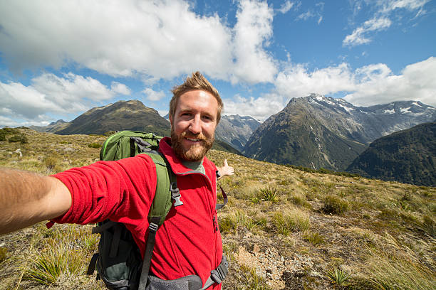 istock Self portrait of young man on mountain top 523824336