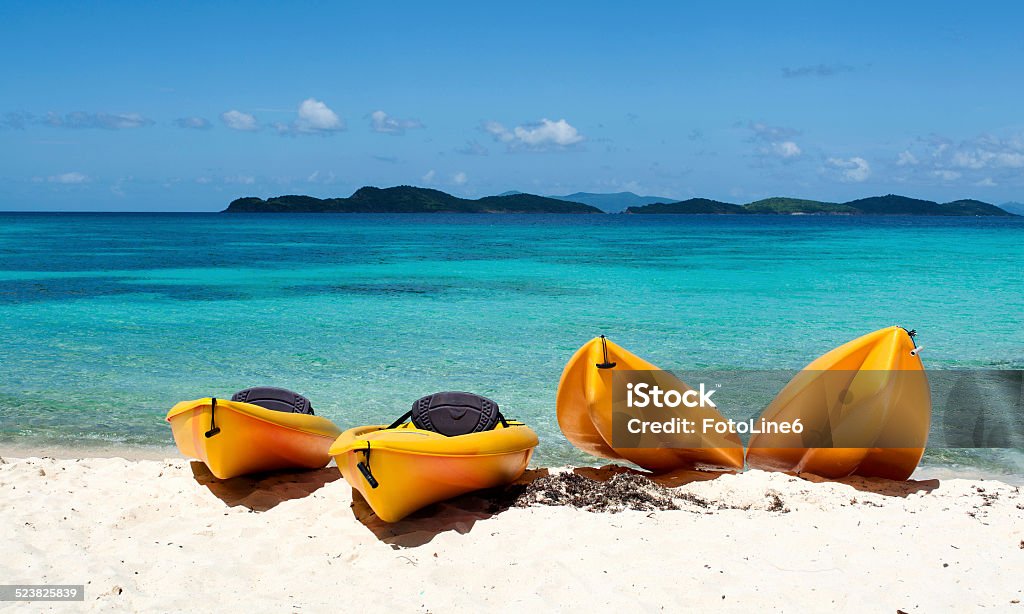 Canoes on the beach Four yellow canoes on the beach, St Thomas, US. Virgin Islands St. Thomas - Virgin Islands Stock Photo