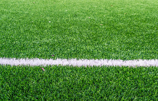 istock White line on football field 523826431
