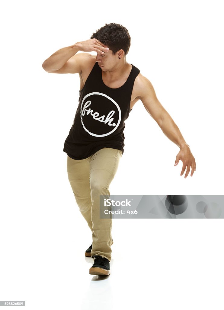 Front view of young man dancing Front view of young man dancinghttp://www.twodozendesign.info/i/1.png 20-29 Years Stock Photo