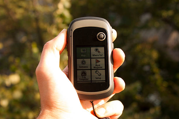 istock Handheld GPS transmiter in nahd on nature 523826923