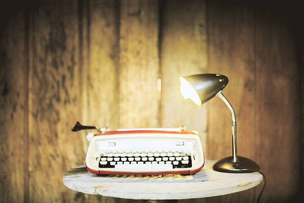 istock Typing machine and lamp on wood 523827758