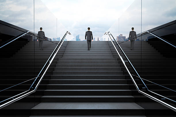 istock Black stairs with businessman 523828190