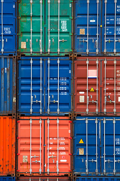 istock Four vertical rows of shipping containers 523828451