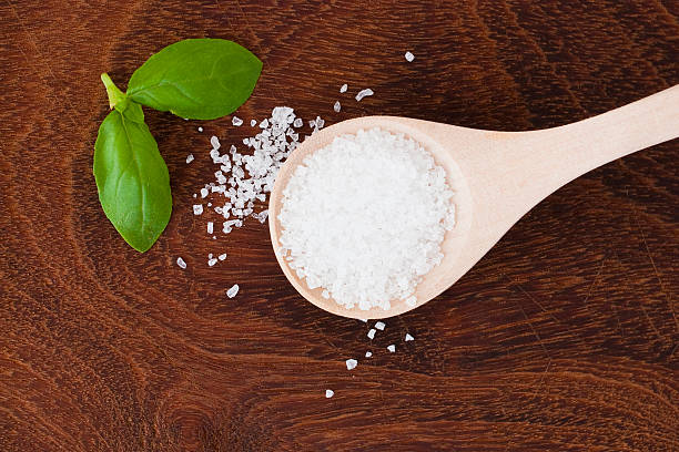 istock salt on wooden background 523828989
