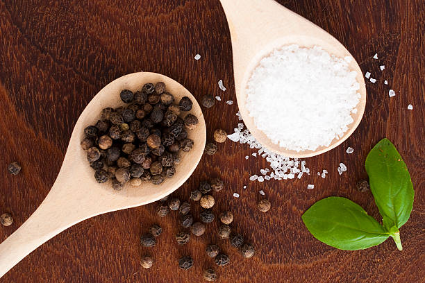 istock salt and pepper on wooden background 523829011