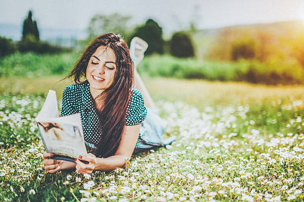 istock beautiful girl reading a book 523829240