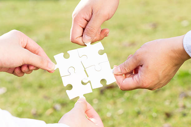 istock puzzle jigsaw and concept with meadow background 523829463