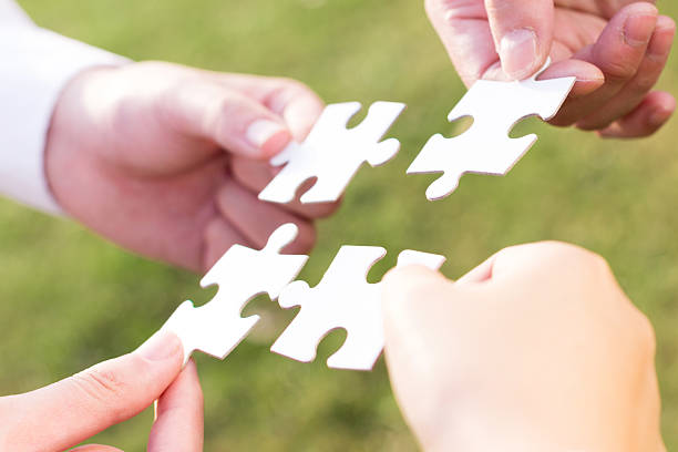 istock puzzle jigsaw and concept with meadow background 523829467