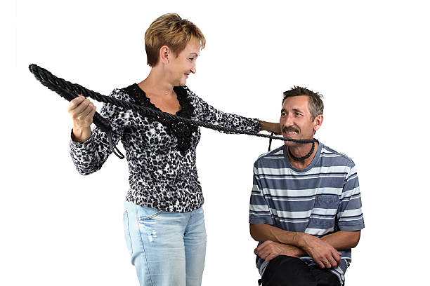 Photo of the ola woman with whip and her husband Photo of the ola woman with the whip and her husband on white background woman strangles man stock pictures, royalty-free photos & images