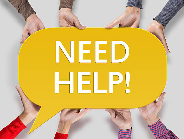 istock Group of friends showing Need Help on speech bubble 523830394