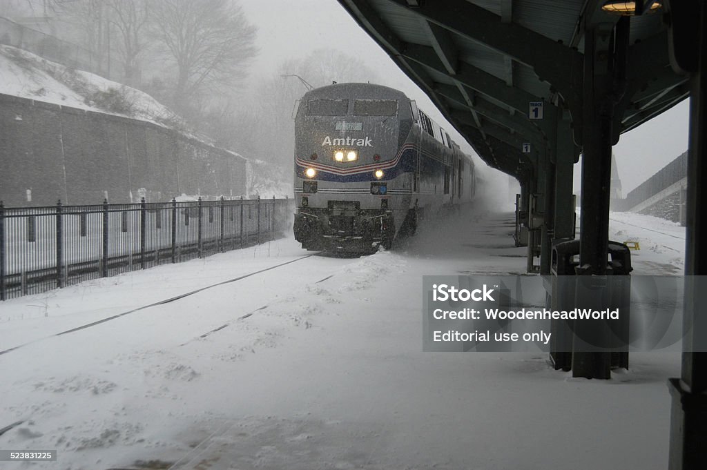 Trains Amtrak passenger train arriving at Rhinecliff, New York station during a snow storm. Built Structure Stock Photo