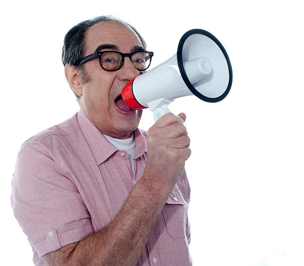 istock Senior casual male with megaphone 523831509