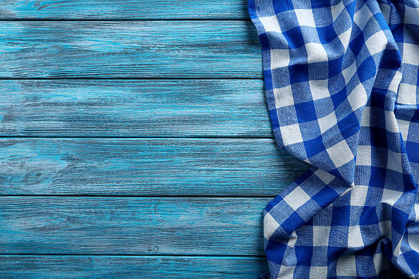 istock Napkin on blue wooden table, close up 523832194