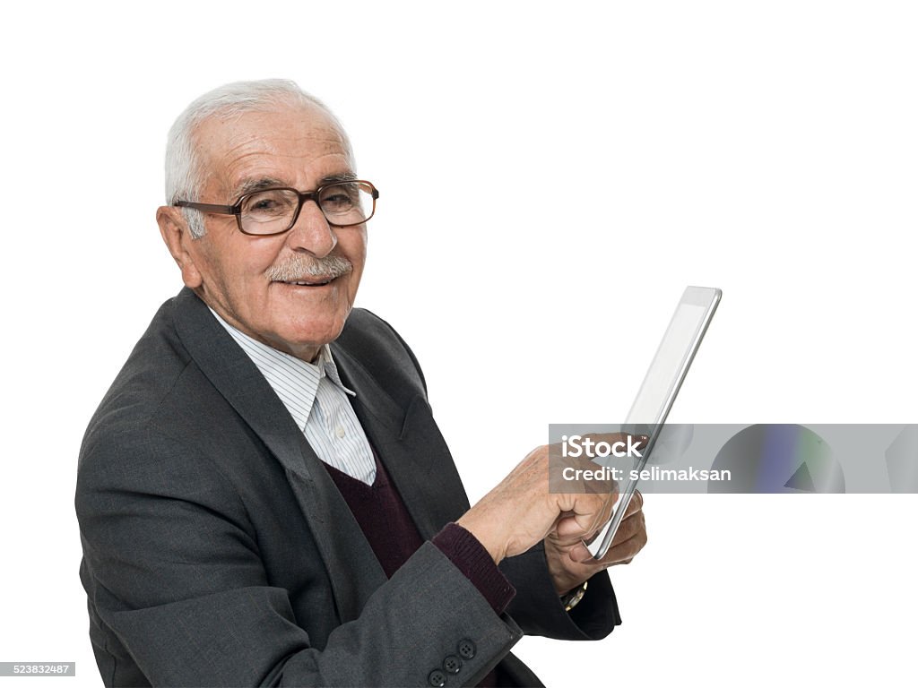 Retired senior man holding digital tablet, with clipping path Retired senior man holding digital tablet, isolated on white with clipping path Senior Adult Stock Photo