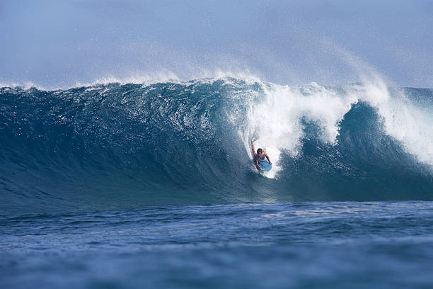 istock Halfway down the face of a big barreling wave 523832652