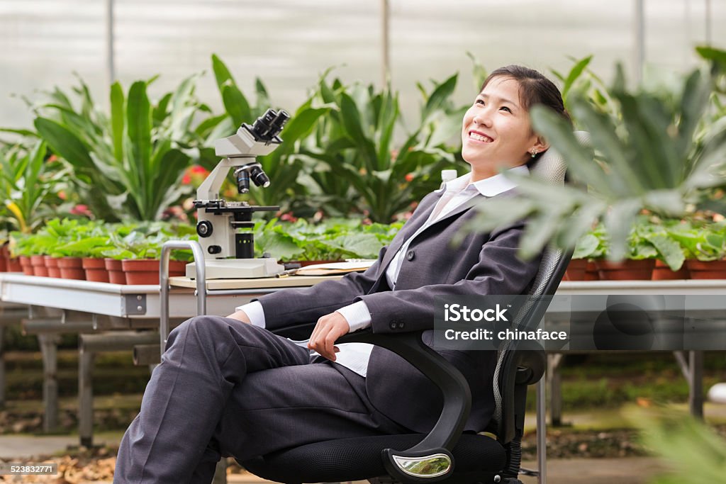 asian businesswoman in greenhouse asian businesswoman working in greenhouse, hong kong china. 20-29 Years Stock Photo