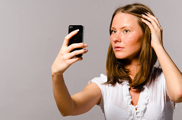 istock woman is taking picture of herself 523832806