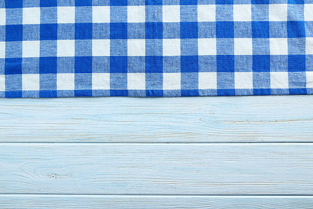 istock Napkin on blue wooden table, close up 523833042