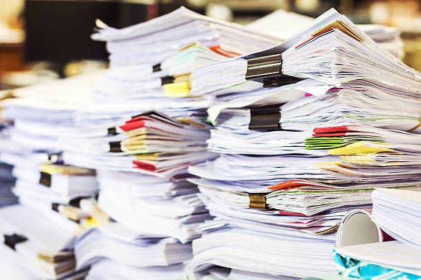 istock Pile of documents with colorful clips on desk stack up 523856166