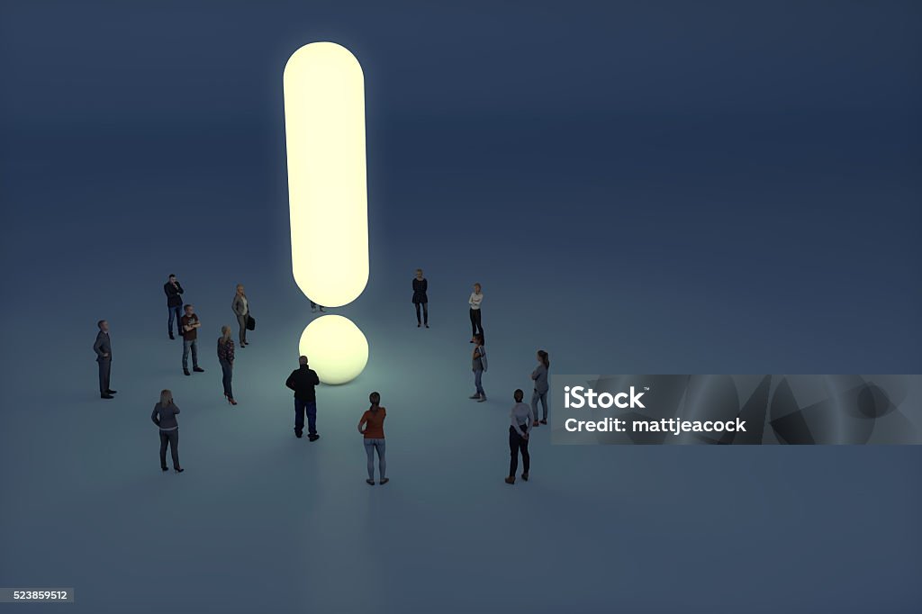 Group of people gathering around a glowing exclamation mark Risk Stock Photo