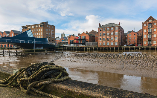 River Hull with house, flats, church in Hull, Yorkshire, UK.