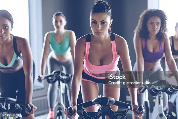 Up To Speed With Their Fitness Goals Stock Photo - Download Image Now - Cycling, Spinning, Gym