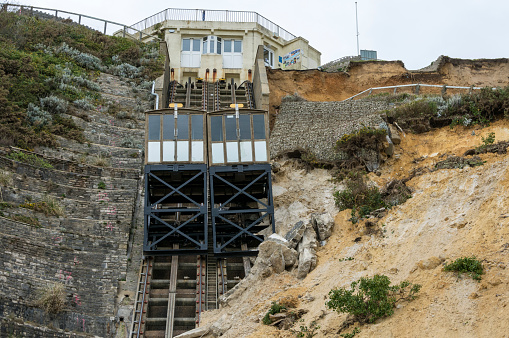 Bournemouth, UK - April 25, 2016: Part of the East Cliff in Bournemouth collapsed on the 24th April 2016. The historic cliff lift was damaged - seen here pushed together and rubble on the tracks. Bournemouth is a popular tourist destination and the collapse happened along the main promenade. 
