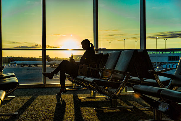 istock Woman Waiting for Her Flight Early Morning 523861308